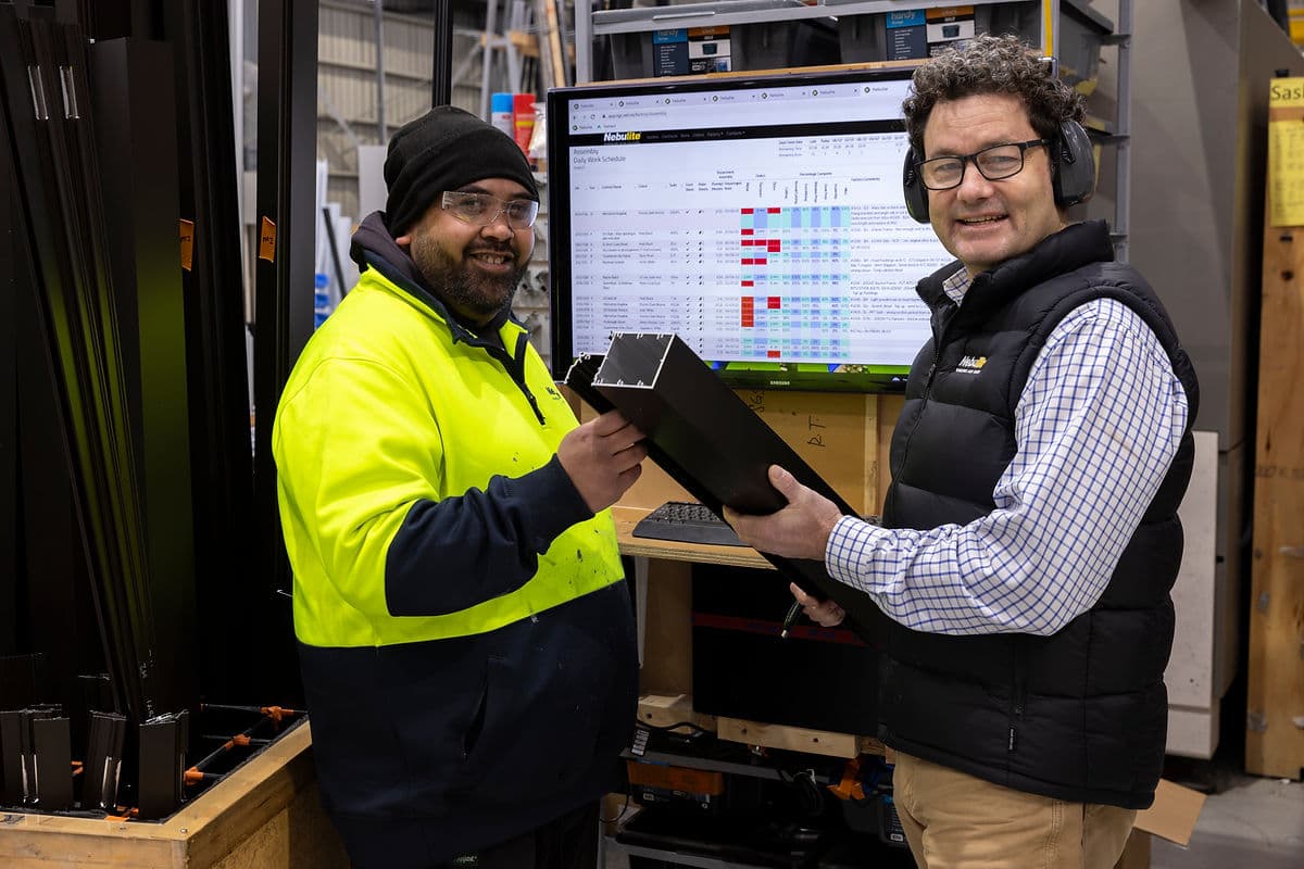 NGC Windows fabricator Frank Manuel and Managing Director Tom Foster review aluminium frames using the Beacon system