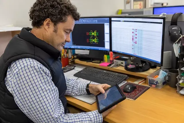 NGC Windows managing director Tom Foster checks orders on the Beacon system